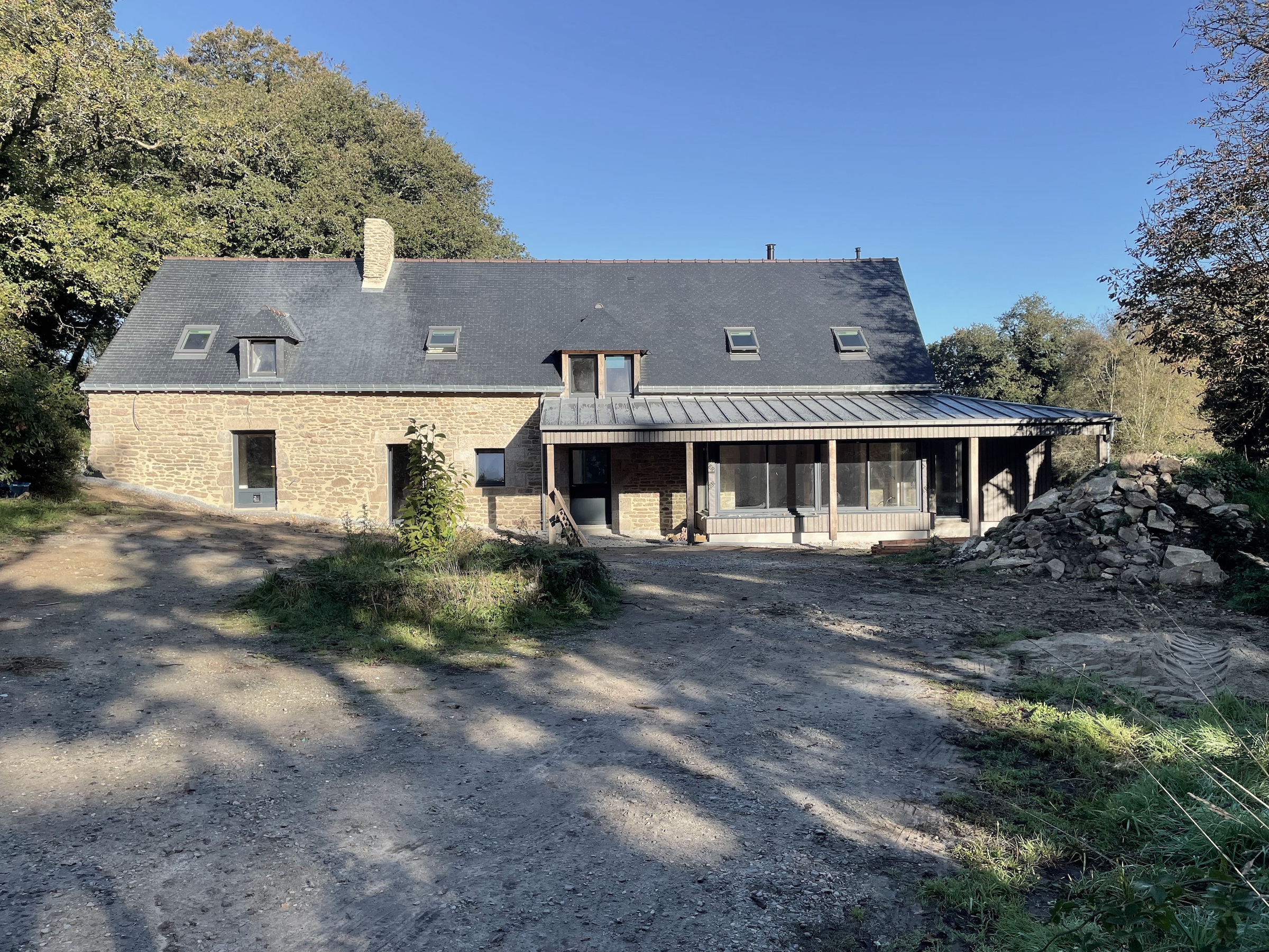 external view showing timber clad extension with zinc roof