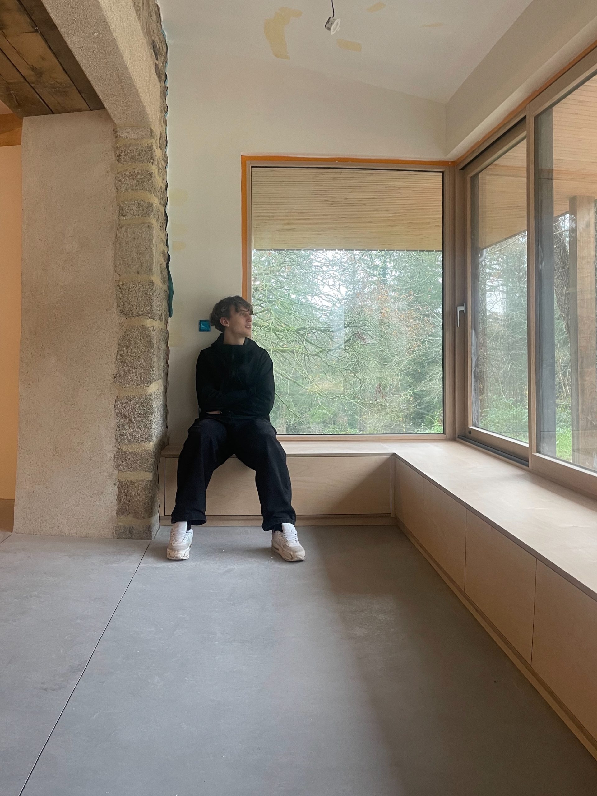 built-in seating/storage in birch-faced plywood made by local artisans